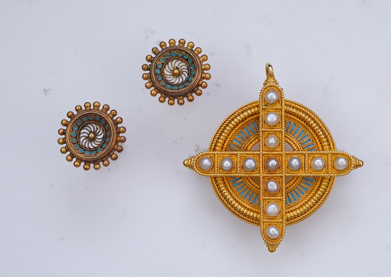 A gold, enamel and pearl pendant/brooch, mid 19th century, and a pair of earrings